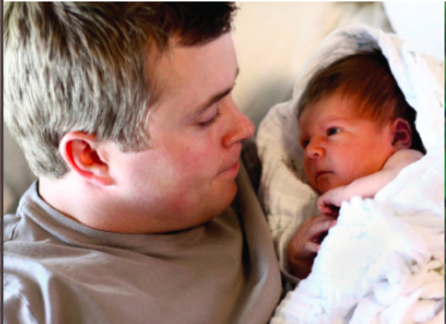 Man stares into babies eyes