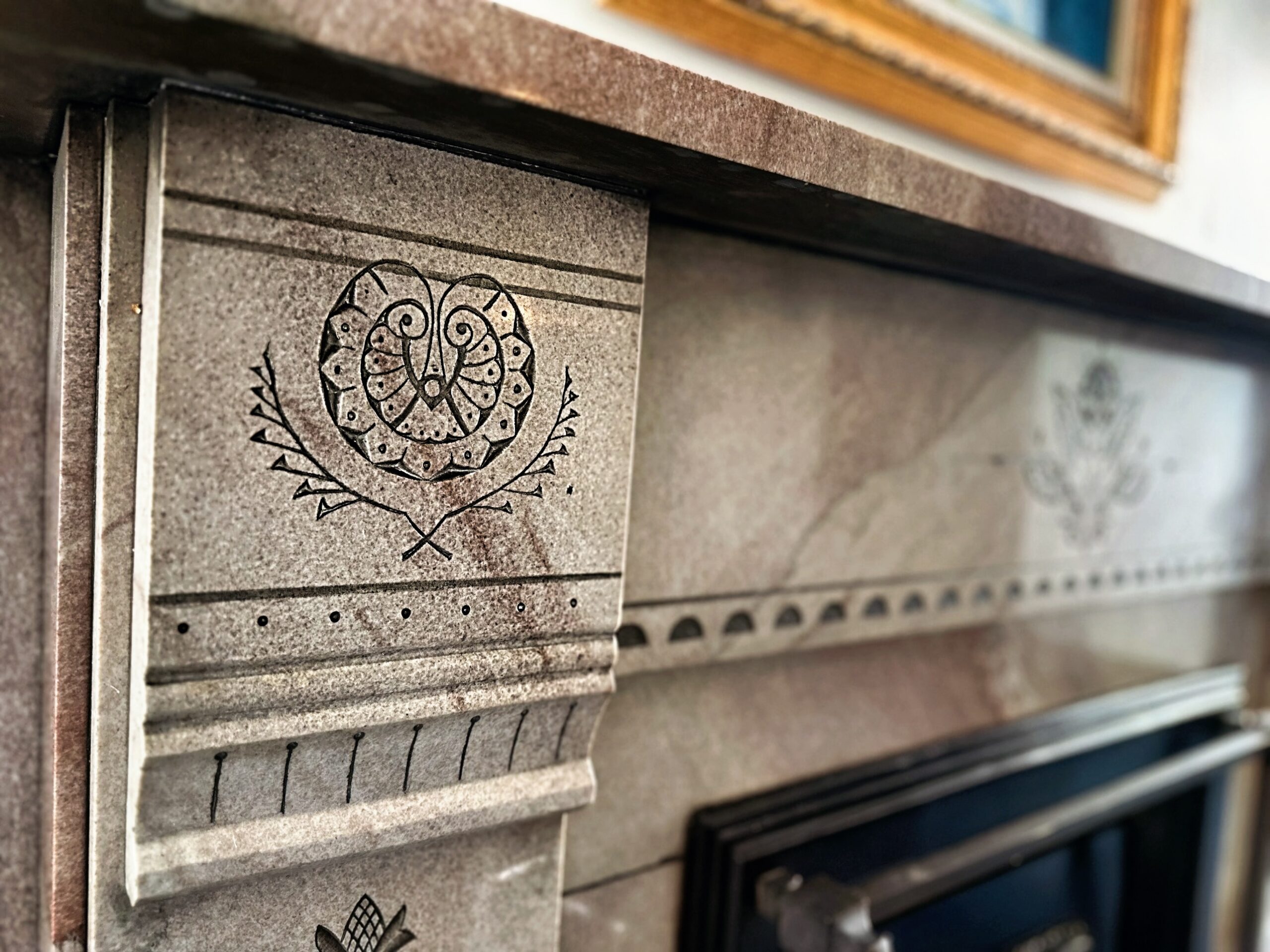 Carved marble fireplace detail at Parker and Parker Attorneys at Law
