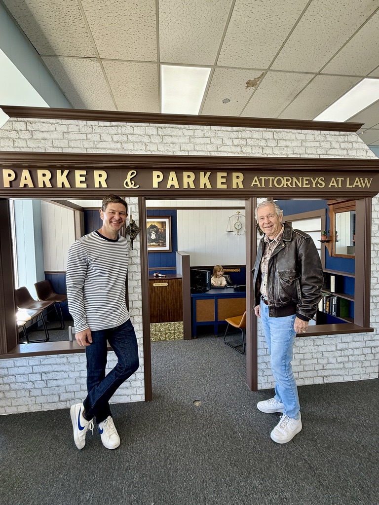 The miniature Parker & Parker Attorneys at Law office at Main Street Play Cafe in Morton, Illinois, with Rob and Drew Parker pictured at the storefront.